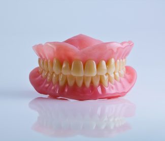 Why Do My Dentures Keep Slipping While I Eat?